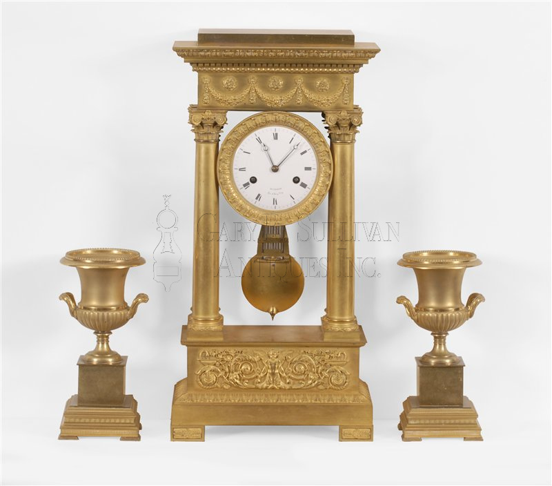 French Classical ormolu clock garniture, circa 1810.